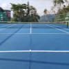 Full-sized tennis courts for students to practice for a grand slam