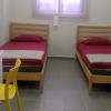 Comfortable twin-sharing dorm rooms with in-house wardens